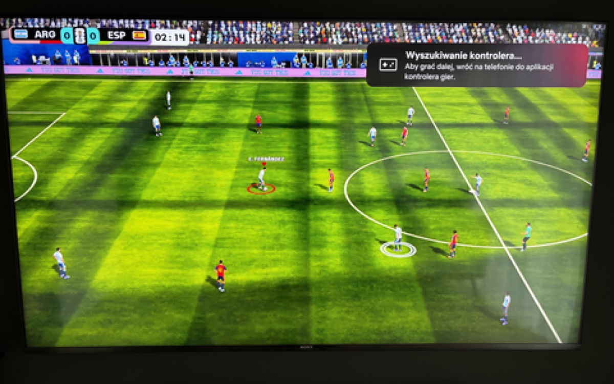 A phone used as a controller for a football game on television